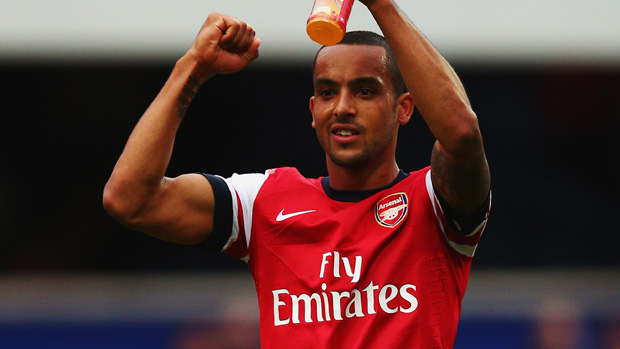 Theo Walcott celebrates Arsenal's win at QPR